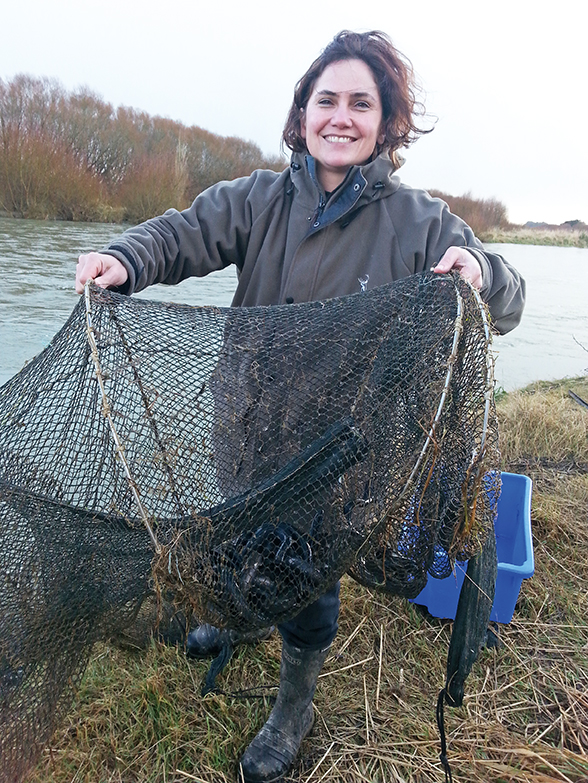 Murihiku-based ecologist and environmental scientist, Dr Jane Kitson with kanakana (lamprey) in her net.