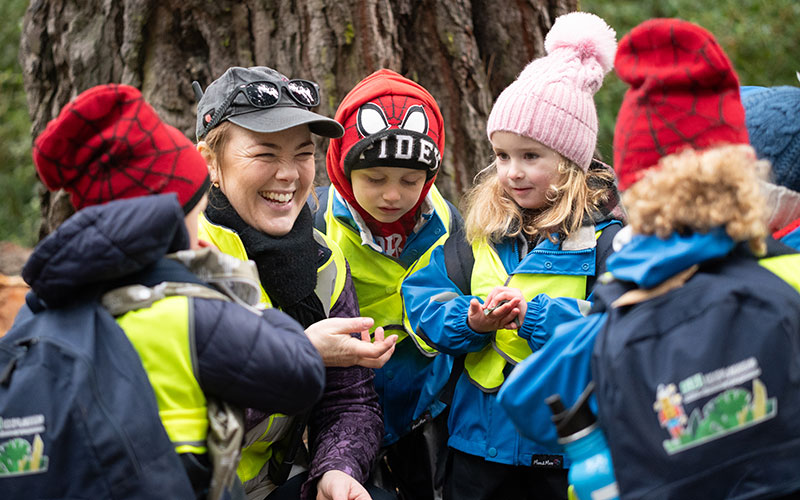 Kate and her explorers investigate a leaf.