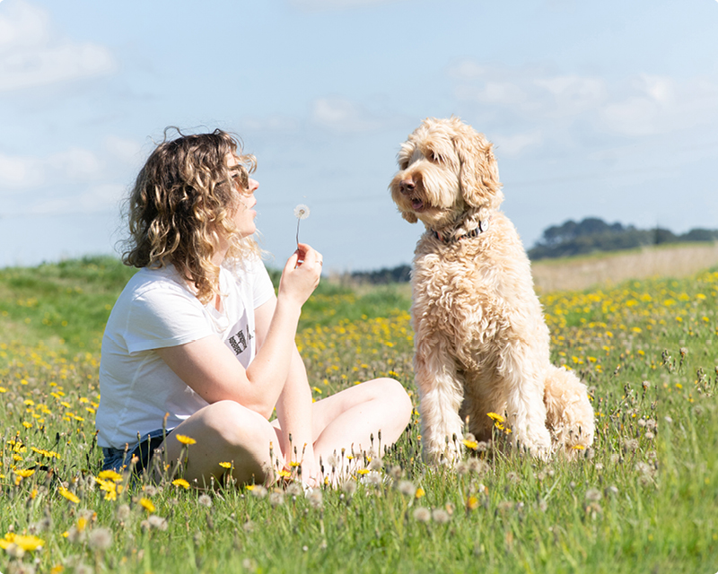 Lady and her dog in a paddock at the Waihopai River, Invercargill